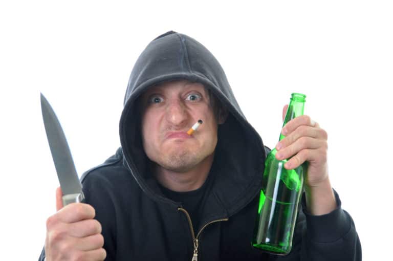 Threatening man with knife and bottle of alcohol