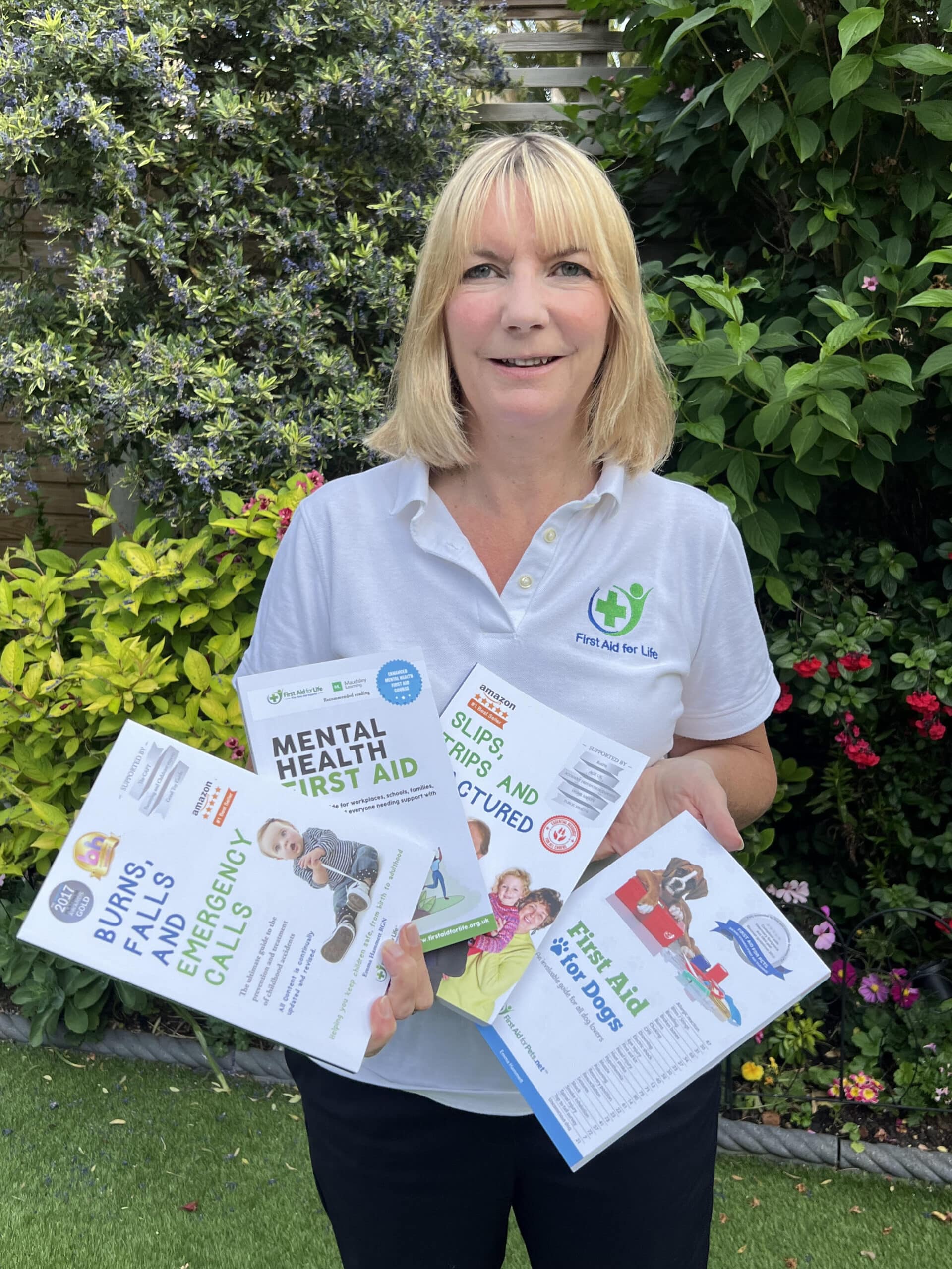 Emma and books Emma Hammett Portrait Image CEO Onlinefirstaid.com